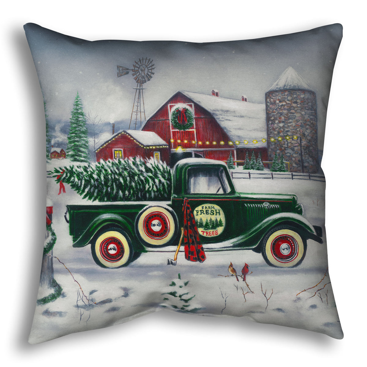 Decorative pillow with a vintage truck and Christmas tree design.