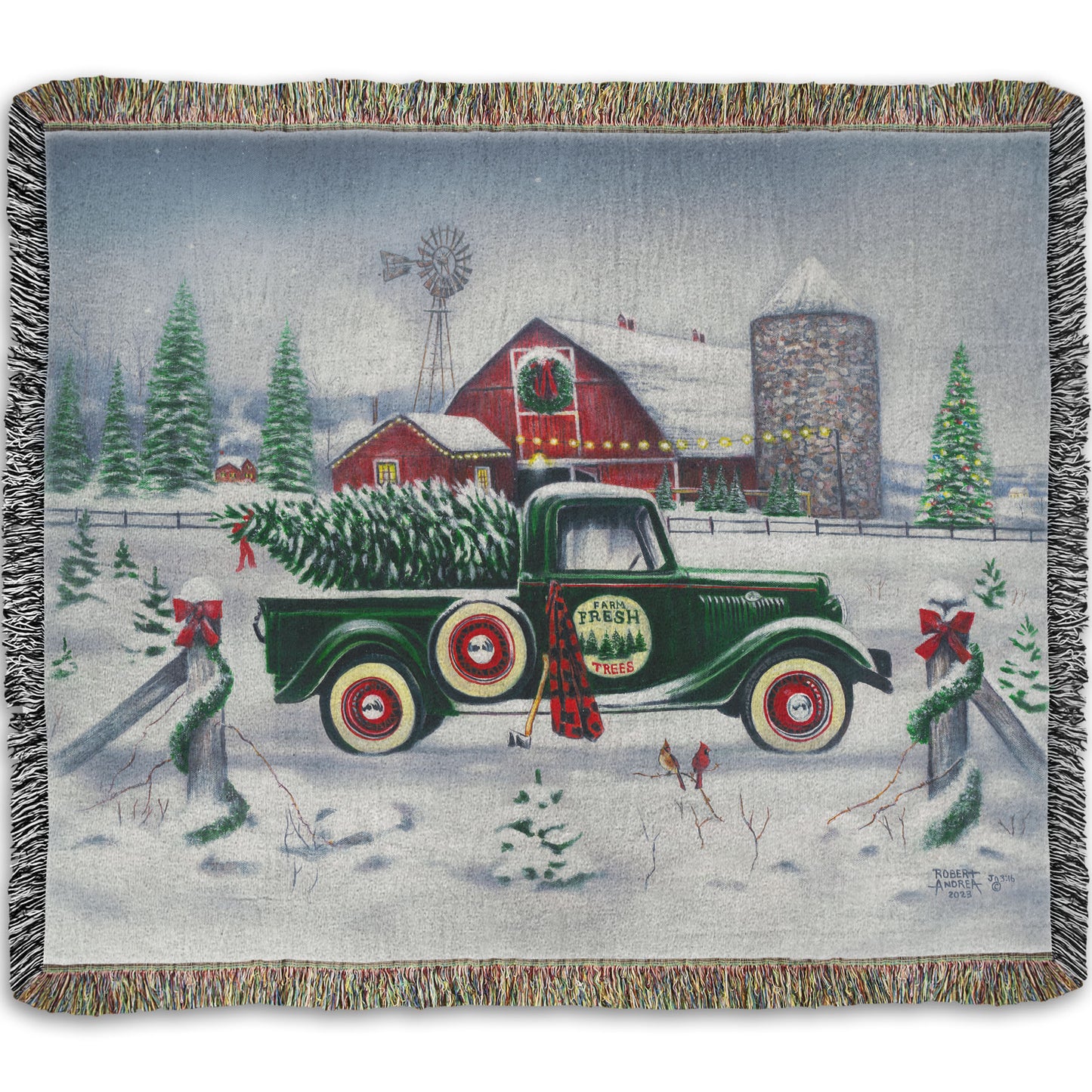 Woven blanket with a vintage truck and cabin design in a winter landscape.