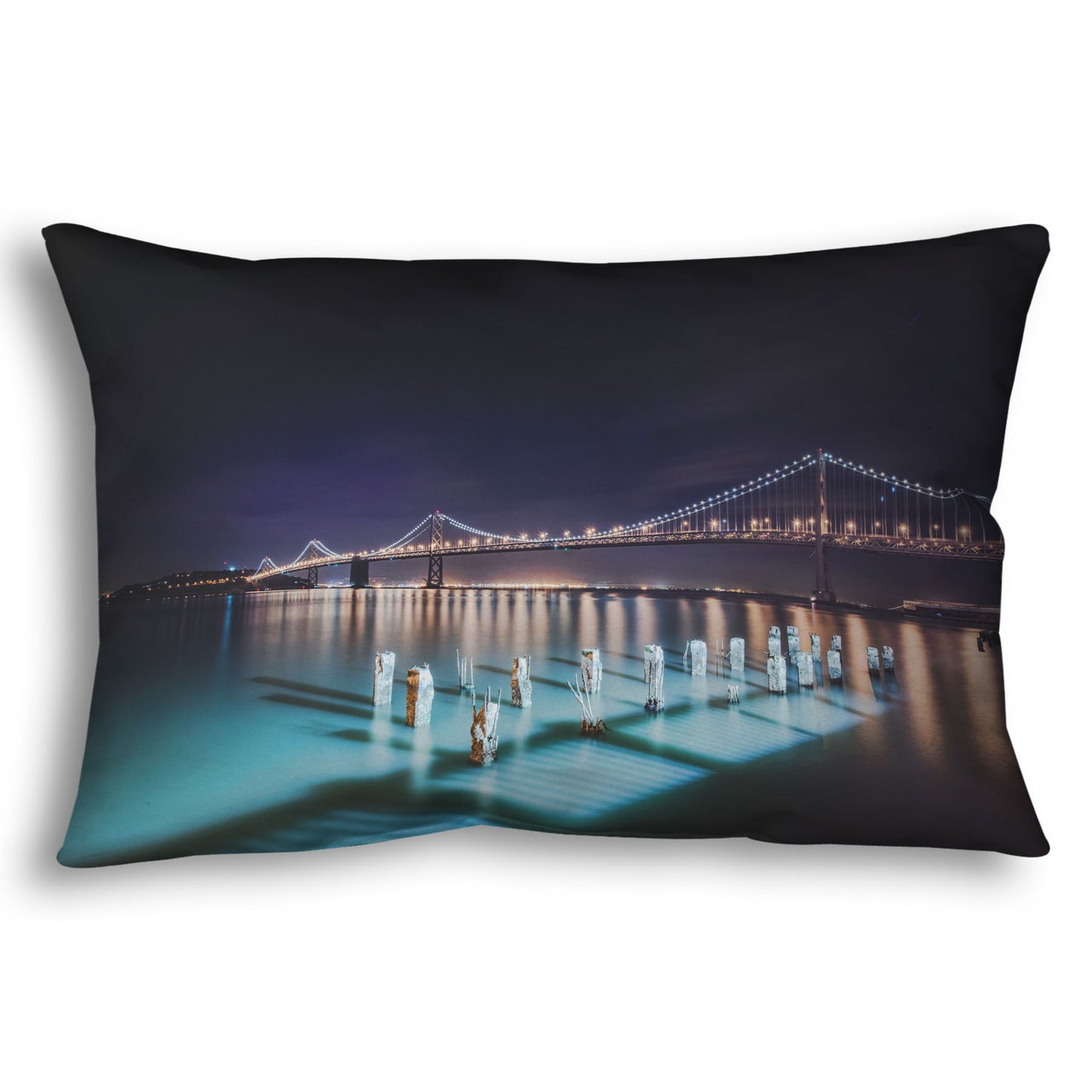 A throw pillow designed with a photo of the Oakland Bay Bridge in San Francisco at night, taken from the Embarcadero.