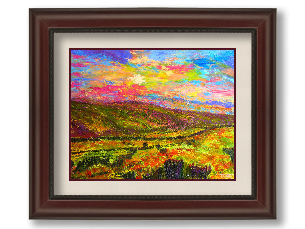 A textured, colorful impressionistic painting of a hilly meadow of flowers and an equally colorful sky. Printed on paper, matted, and framed.