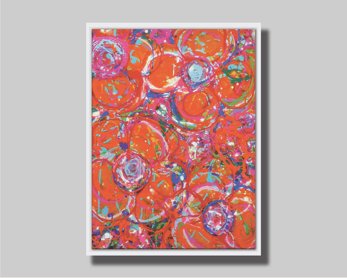 A drip painting of a cluster of abstracted flowers created with splatters of orange, red, and pink with accents of green, blue, yellow, and purple. Printed on canvas in a float frame.