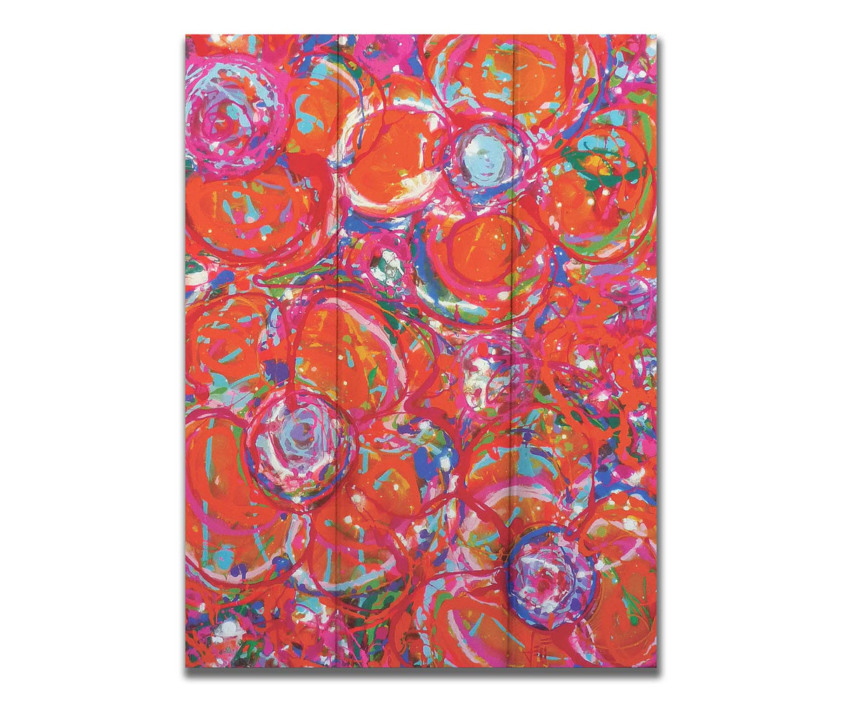 A drip painting of a cluster of abstracted flowers created with splatters of orange, red, and pink with accents of green, blue, yellow, and purple. Printed on a box board.