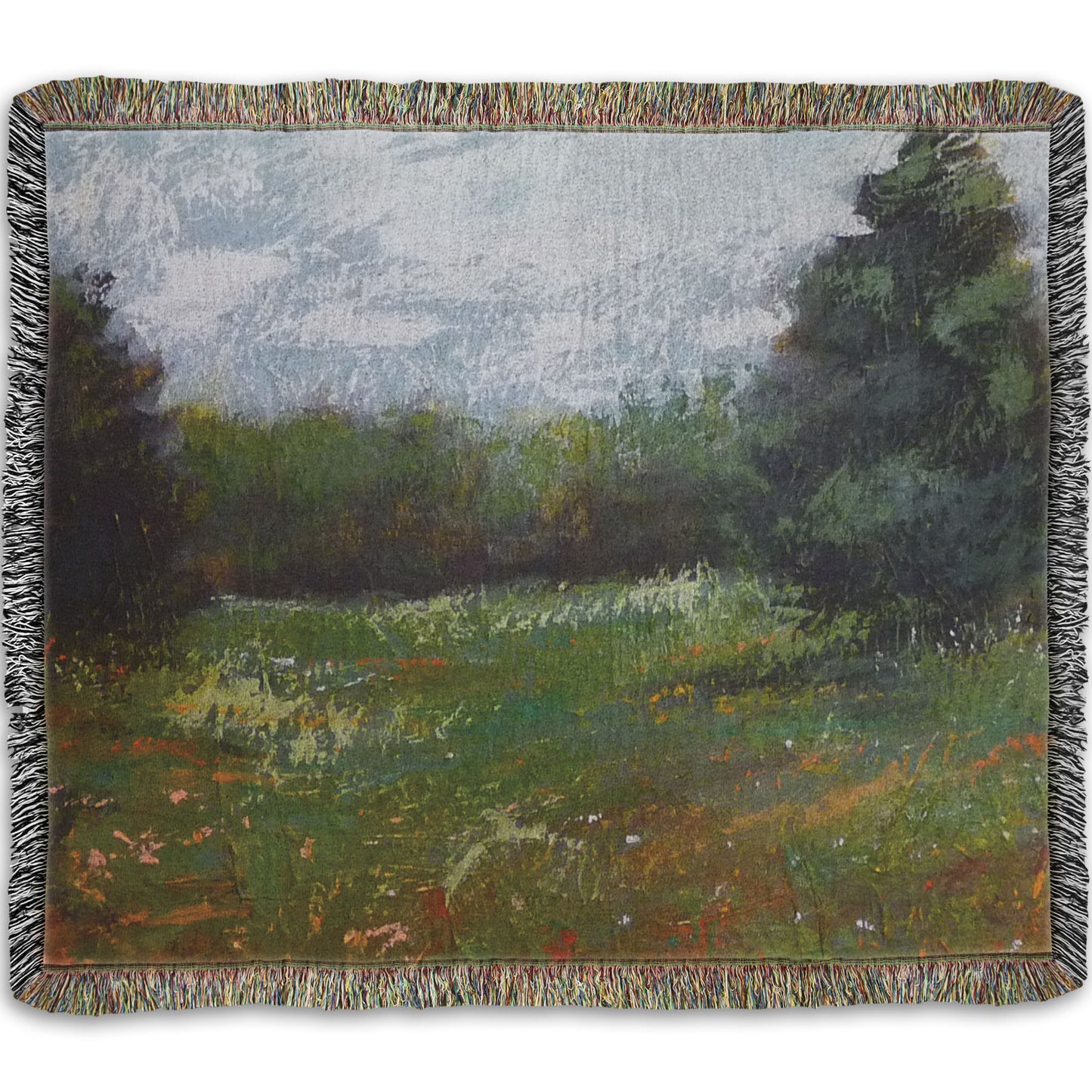 A woven throw blanket designed with an expressive painting of a grassy field and grove of trees.