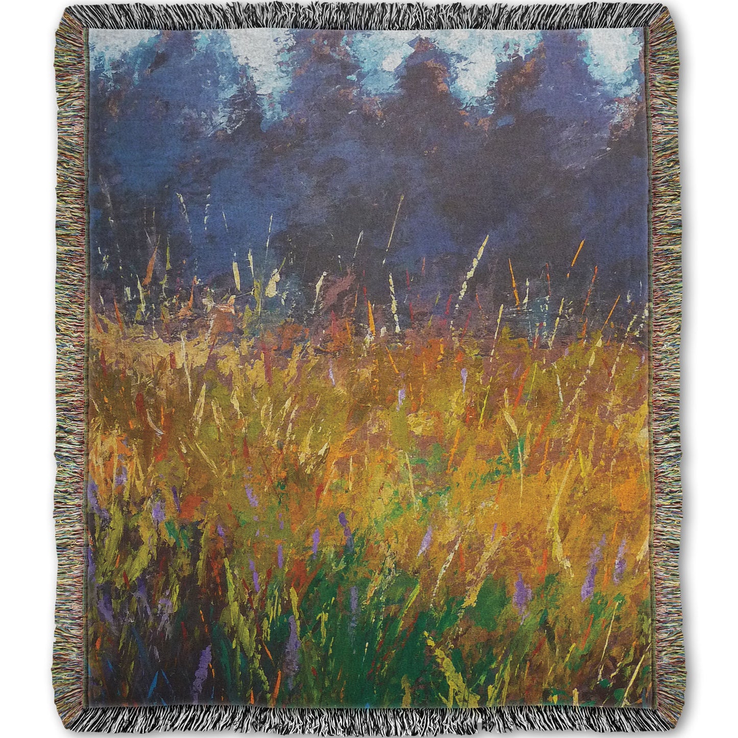 A woven throw blanket designed with an expressive painting of a gold and green field in front of a purple and blue forest.