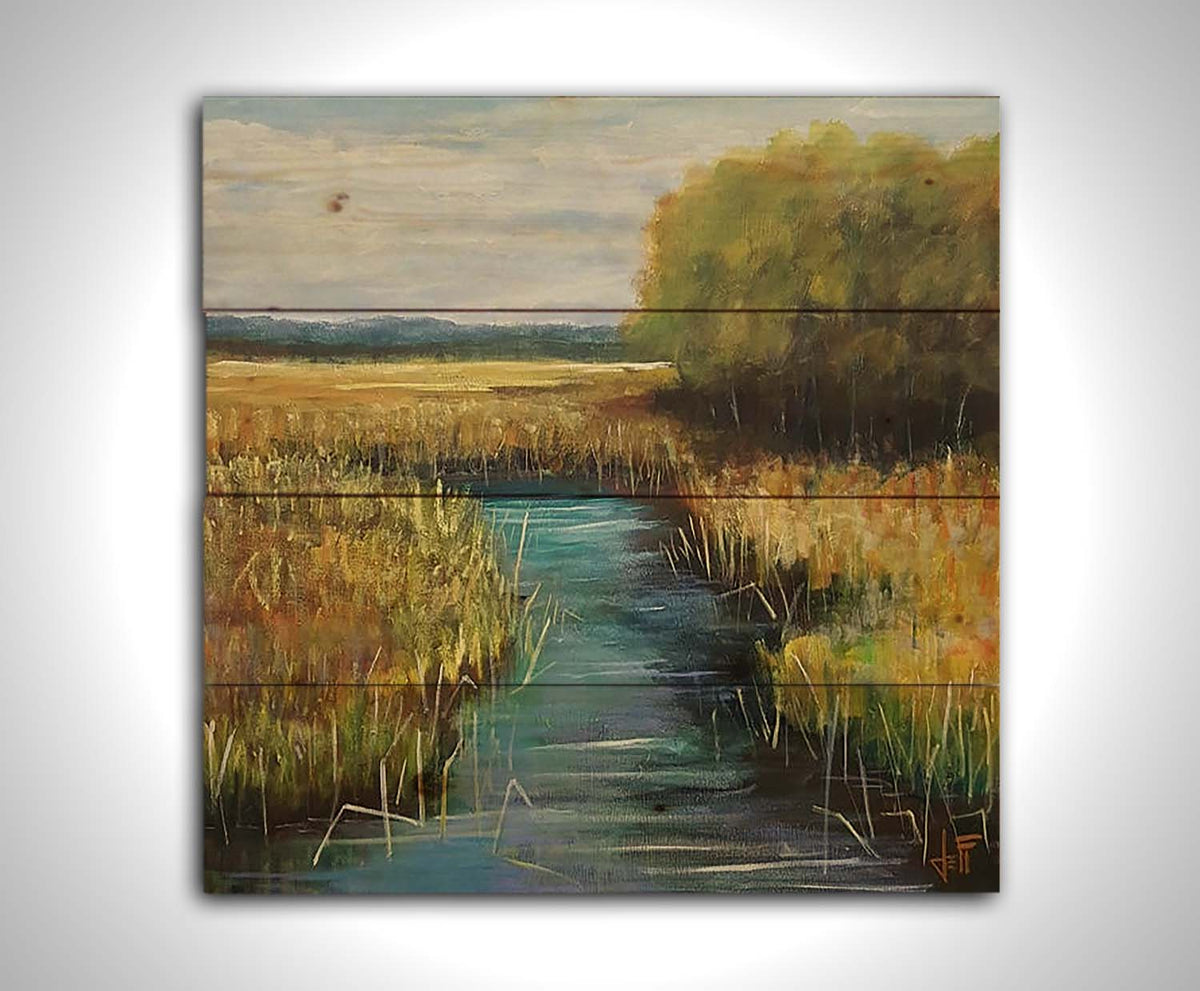 A painting of a stream running through fields of yellow grasses, with clusters of trees to one side. Printed on a wood pallet.