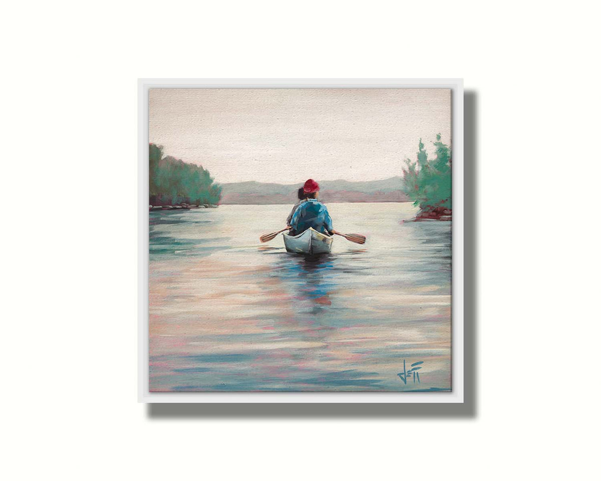 A painting of two people paddling a canoe across a lake in the early morning. The sky is pale reflecting on the water, and green trees line the shore along the lake. Printed on canvas in a float frame.