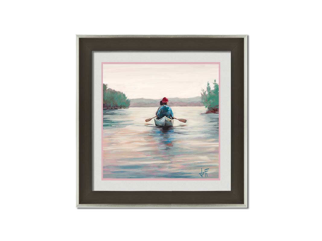 A painting of two people paddling a canoe across a lake in the early morning. The sky is pale reflecting on the water, and green trees line the shore along the lake. Printed on paper, matted, and framed.