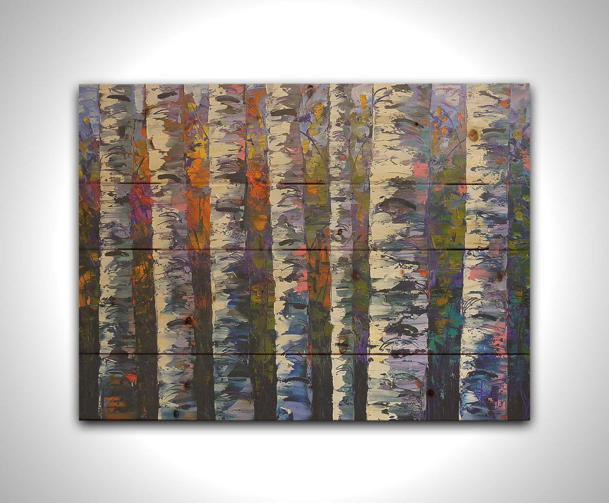 An expressive impasto painting of a birch forest. Parallel white trunks shadowed with blue and purple are backed by a rainbow of leaves. Printed on a wood pallet.