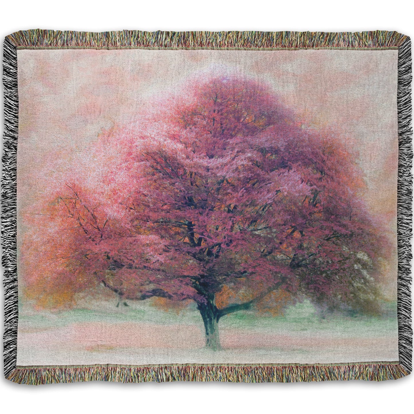 A woven throw blanket designed with an edited photo of a beech tree, its leaves pink for autumn. It has been modified to have a painterly look.