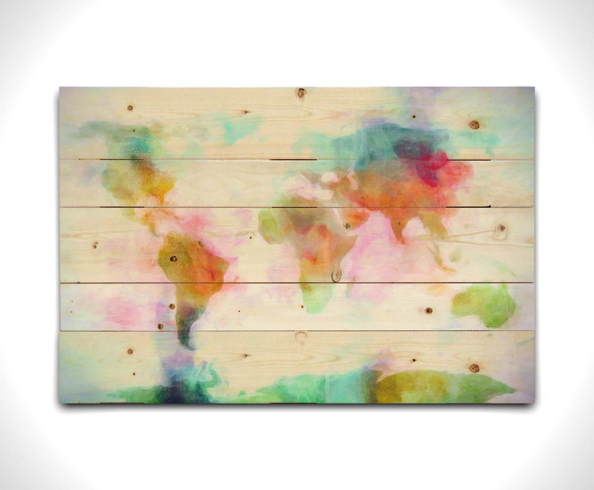 A graphic of the world map, digitally edited in a watercolor-like style in red, yellow, and green on white. Printed on a wood pallet.