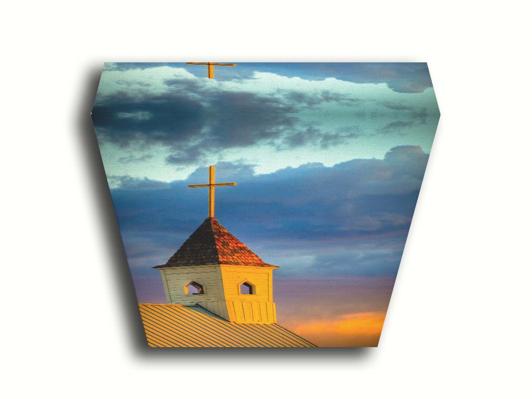 A photo of a cross-topped church at sunset, the sky gradating from blue to purple to orange. Printed on canvas.