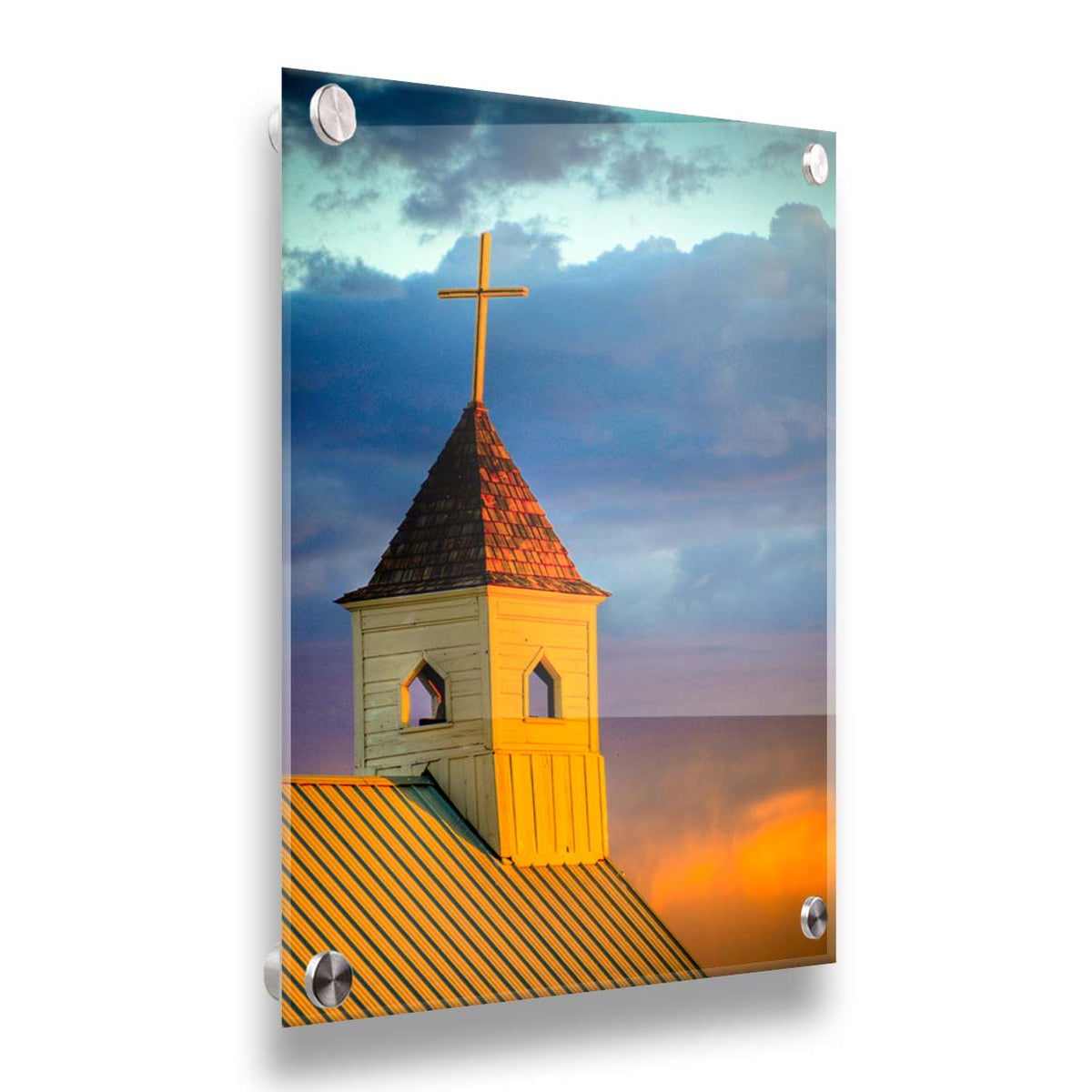 A photo of a cross-topped church at sunset, the sky gradating from blue to purple to orange. Printed on acrylic.