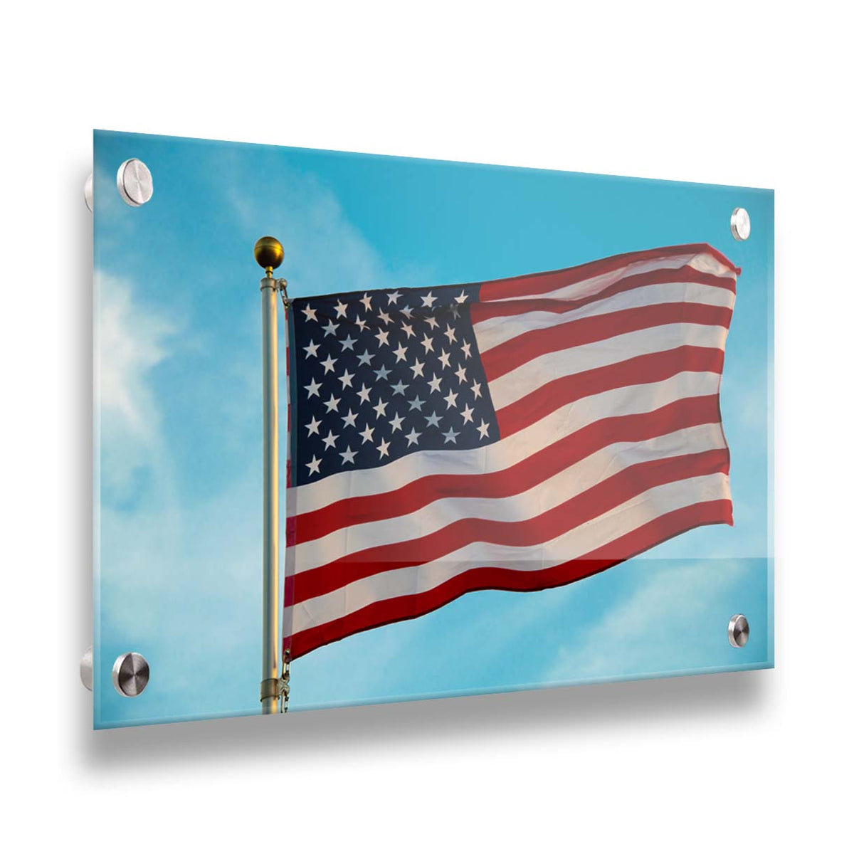 A photo of an American flag against a bright blue sky. Printed on acrylic.
