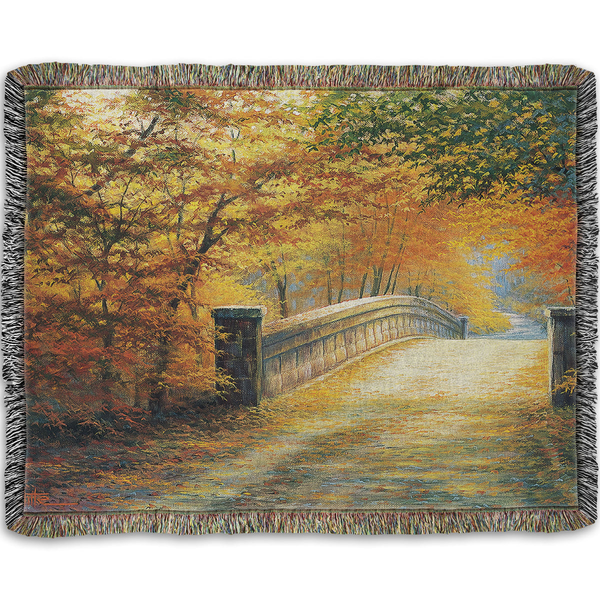 A woven throw blanket designed with a painting looking down a bridge road during fall. The trees lining the road have turned yellow and orange for autumn, and some of their fallen leaves are scatted along the path.