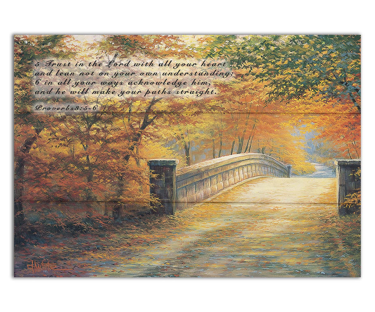 A painting looking down a bridge road during fall. The trees lining the road have turned yellow and orange for autumn, and some of their fallen leaves are scatted along the path. It is overlaid in the upper left with Proverbs 3:5-6 of the Bible, reading "5. Trust in the Lord with all your heart and lean not on your own understanding; 6. In all your ways acknowledge him, and he will make your paths straight." Printed on a box board.