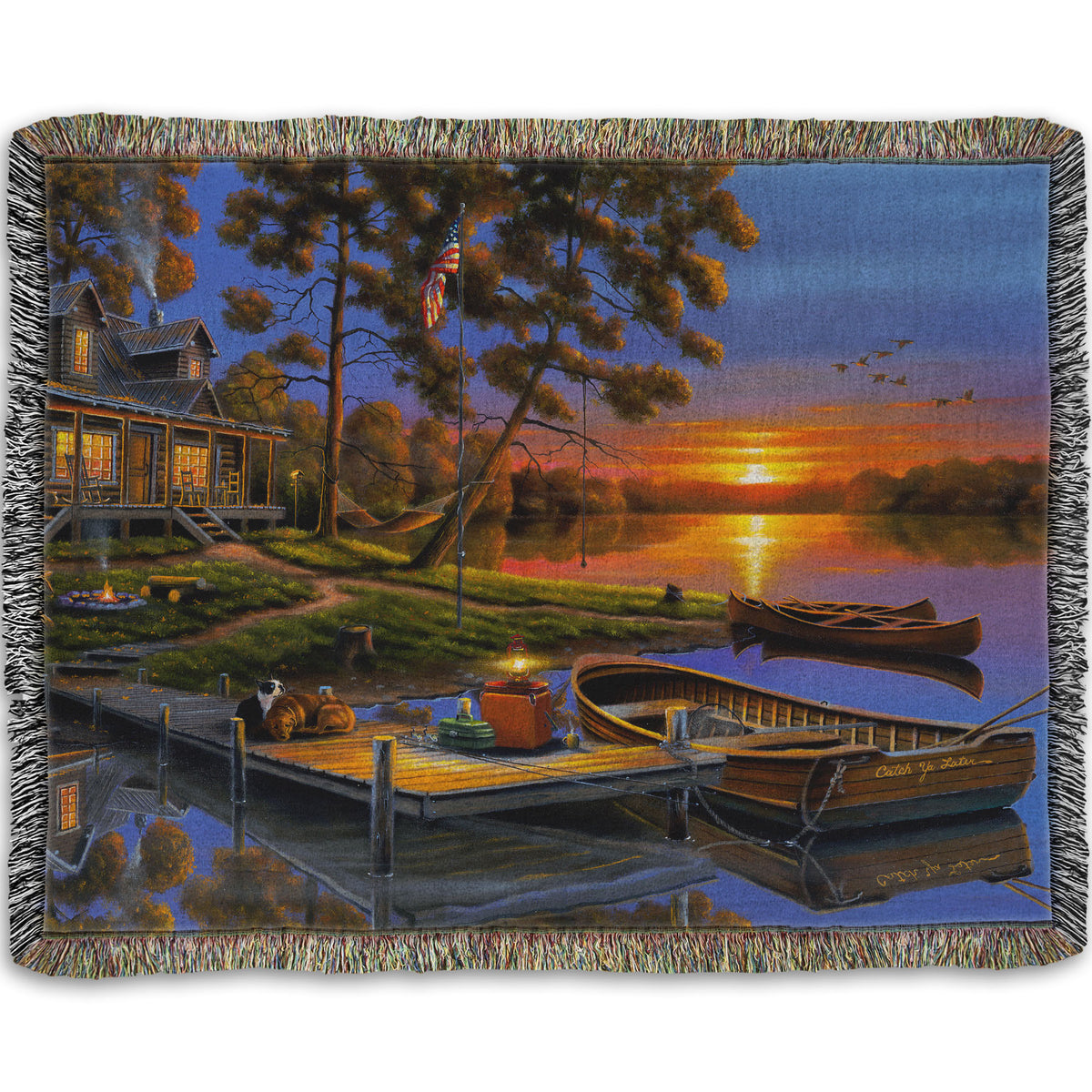 A woven throw blanket designed with a painting of an American lakeside cabin at sunset, with boats on the water and geese overhead.