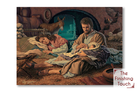 A religious painting depicting Joseph holding baby Jesus while Mary rests, all quietly watched by the farm animals.