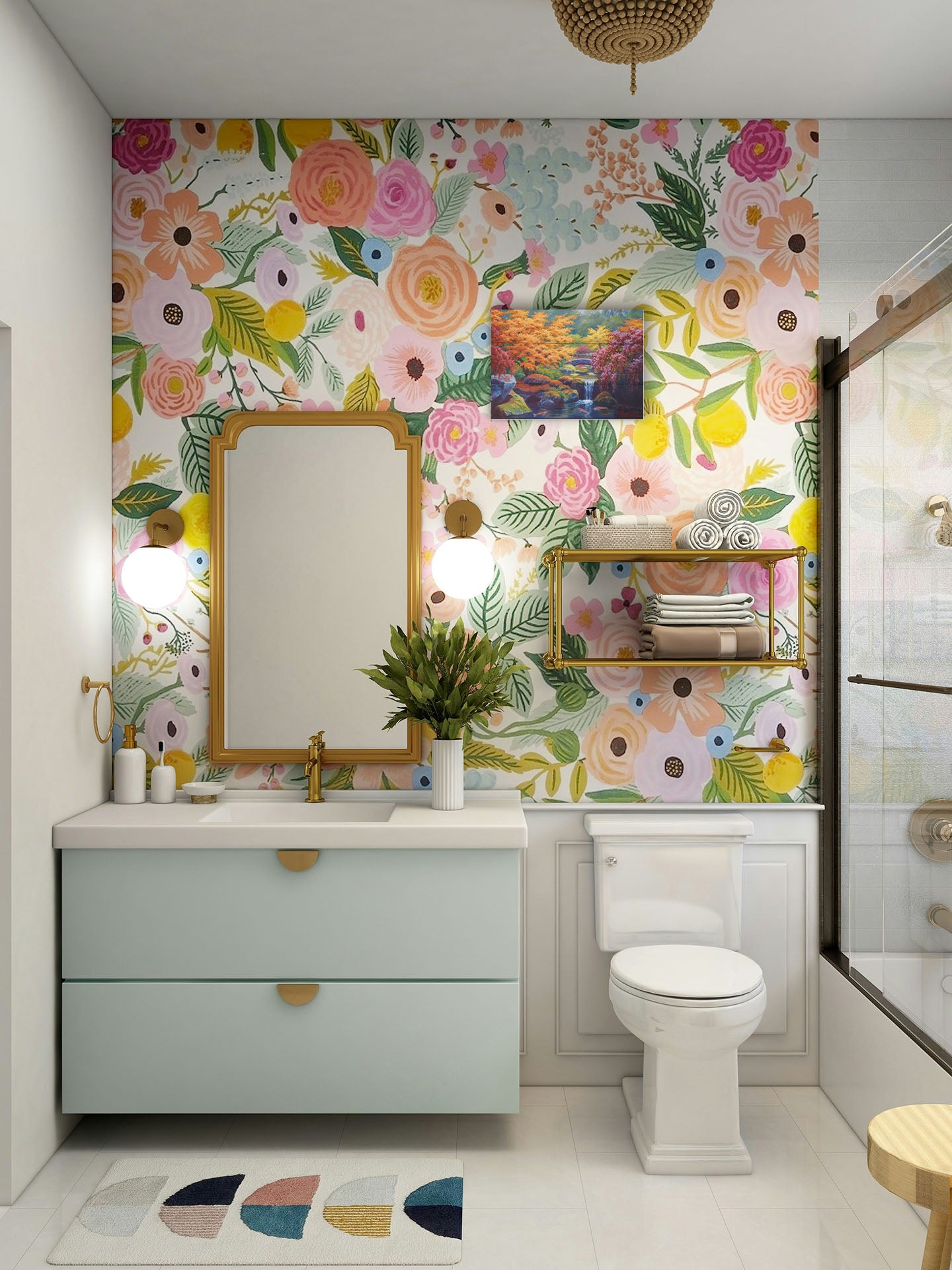 A painting hanging on a bathroom wall. A painting of a garden with red, orange, and green trees. A stone bridge crosses a stream, which runs as a waterfalli into a pond of koi carp. Printed on a box board.