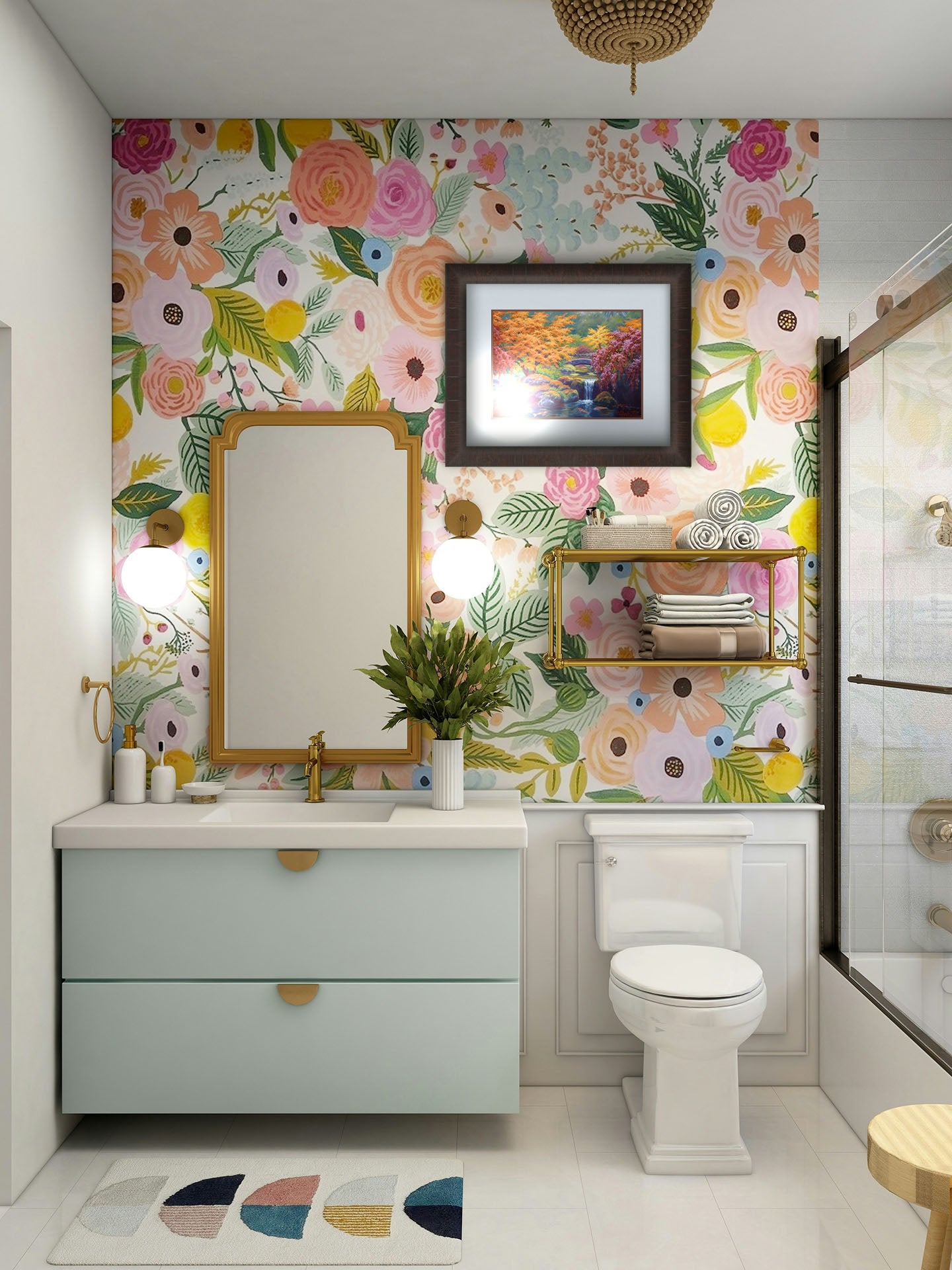 A painting hanging on a bathroom wall. A painting of a garden with red, orange, and green trees. A stone bridge crosses a stream, which runs as a waterfalli into a pond of koi carp. Printed on paper, matted, and framed.