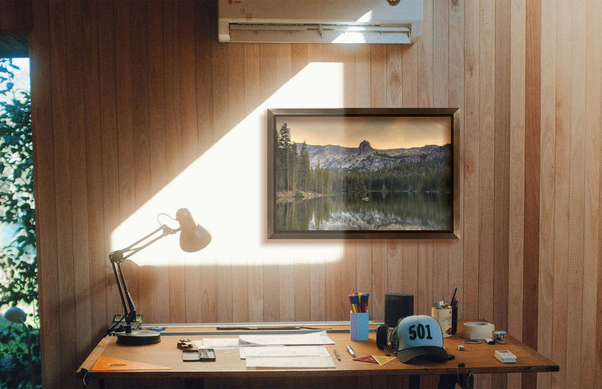A photograph hanging on a study wall. A photo overlooking Lake Mamie, one of the Mammoth Lakes at Mammoth Mountain in California. Printed on canvas and framed.
