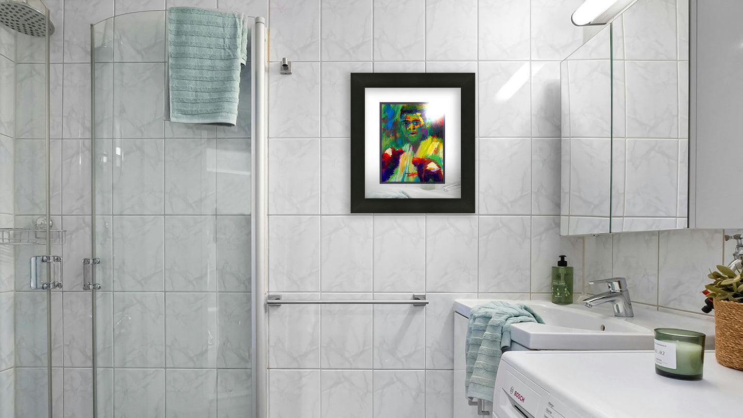 A painting hanging on a bathroom wall. A painting of legendary boxer Muhammad Ali, created with arbitrary color in large brushstrokes. Printed on paper, matted, and framed.