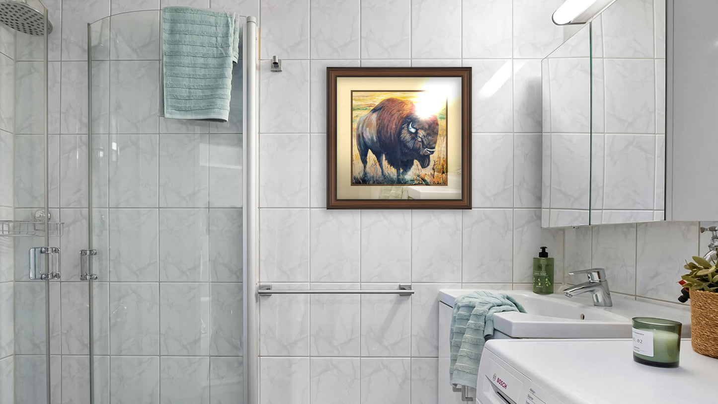 A painting hanging on a bathroom wall. A painting of an American bison, standing in a light yellow field. Printed on paper, matted, and framed.