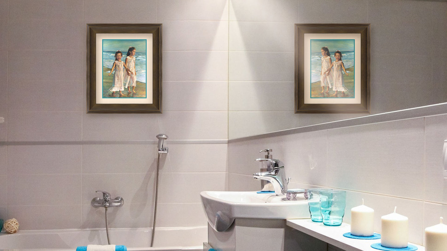 A painting hanging on a bathroom wall. A painting of two children walking along the beach in matching white dresses. Printed on paper, matted, and framed.