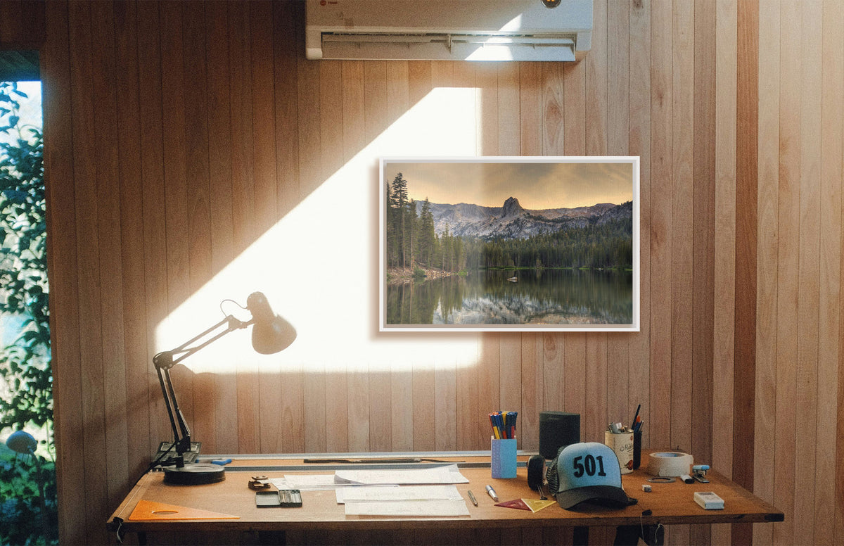 A photograph hanging on a study wall. A photo overlooking Lake Mamie, one of the Mammoth Lakes at Mammoth Mountain in California. Printed on canvas in a float frame.
