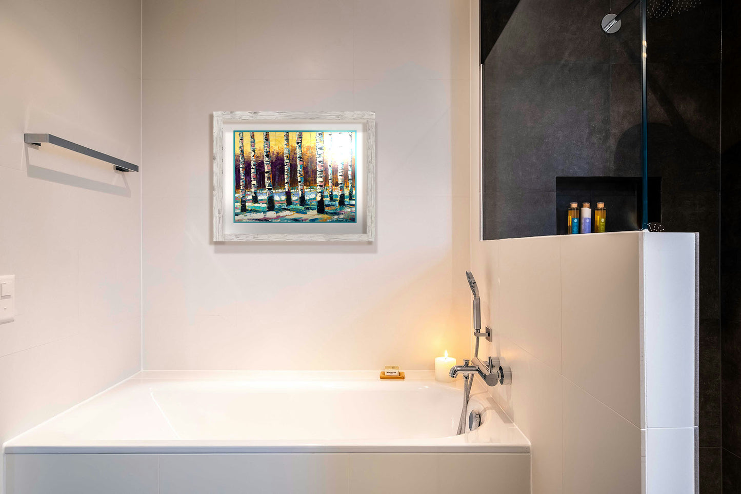 A painting hanging on a bathroom wall. A painting of a birch forest in the winter. The ground is coated in white snow, matching the white bark of the trees, which cast blue shadows onto the snow. Printed on paper, matted, and framed.