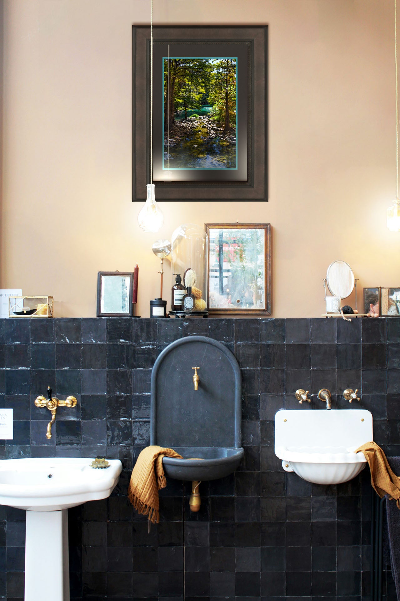 A photograph hanging on the bathroom wall. A photograph of the Guadalupe River in Gruene, Texas. Trees and foliage thrive around the water source, creating a lush green scene. The river reflects a vibrant turquoise behind the trees. Printed on paper, matted, and framed.