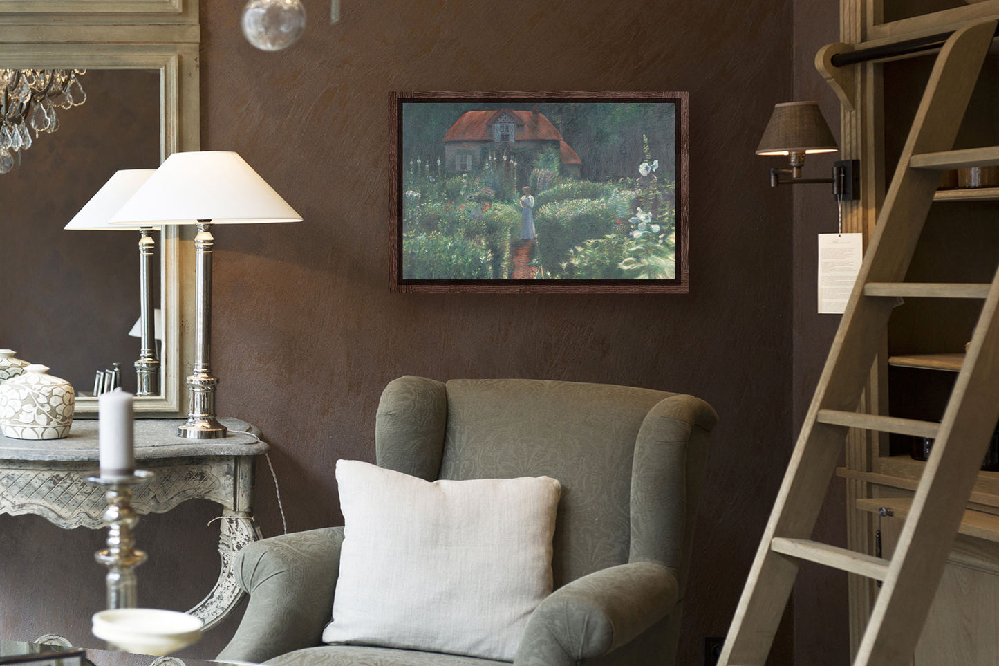 A painting hanging on a study wall. A painting of a person standing in a proliferous garden before a small house. Bushes of flowers in red, blue, white, yellow, and pink fill the scene. Printed on canvas in a float frame.