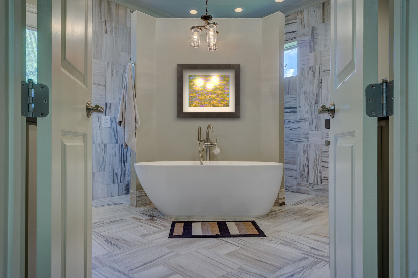 A painting hanging on a bathroom wall. A painting of water lilies with yellow flowers on a pink pond. Printed on paper, matted, and framed.