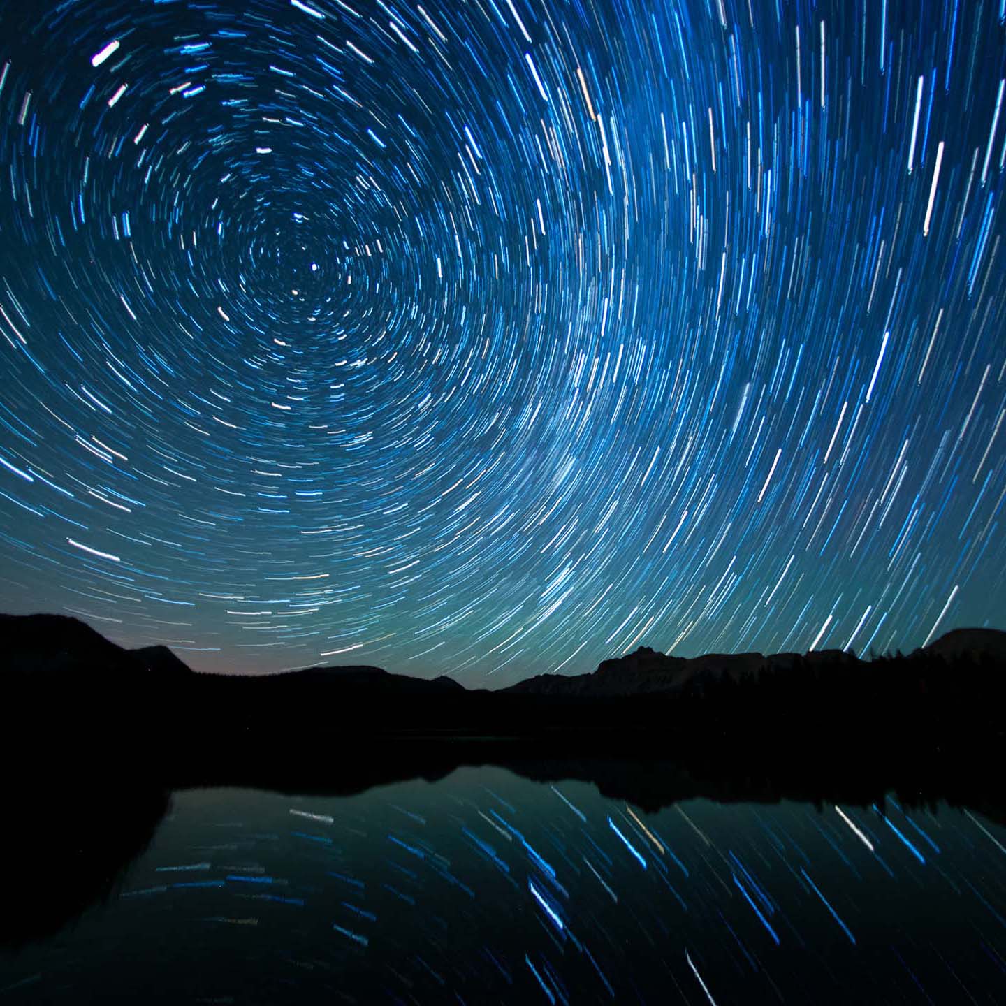 A photo of the Perseid Meteor shower reflecting off of Mirror Lake in Utah.