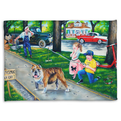 A coral fleece throw blanket designed with a painting of a dog walking on wet cement, leaving paw prints everywhere. Two children are trying to catch the dog using a bone on a stick, and an onlooking construction worker panics. 