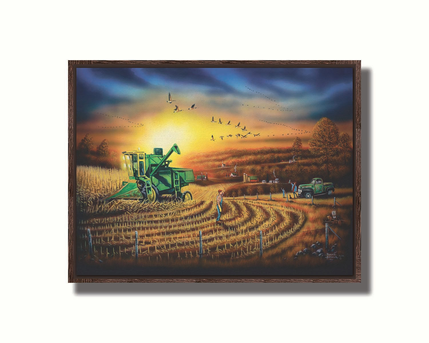 A painting of a harvester at work, gracefully cutting through fields of golden corn stalks. Geese fly overhead, illuminated by the sun on the horizon. Printed on canvas in a float frame.