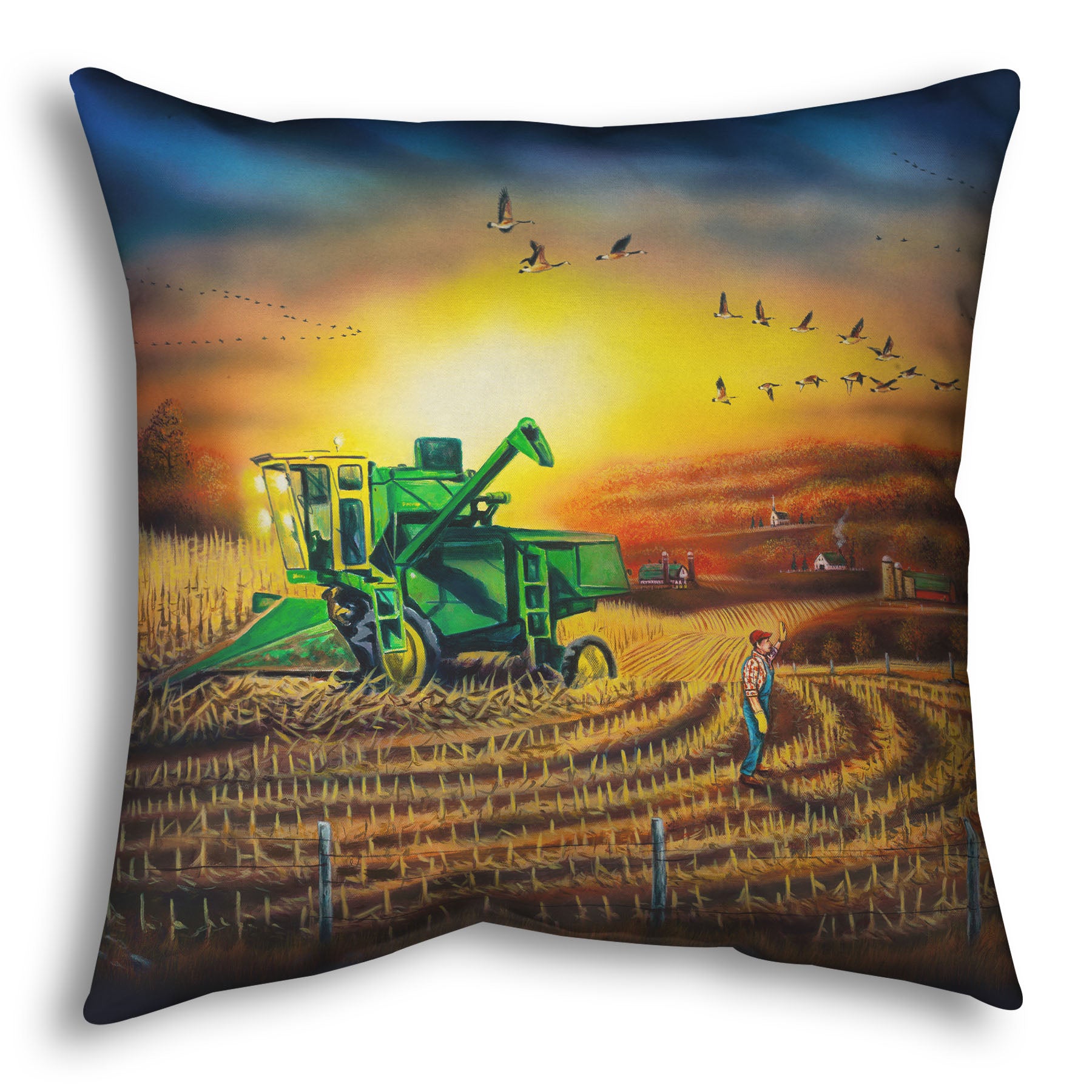 Throw pillow with a scenic design of a farm landscape, with a harvester stopped in a partially harvested field of corn.