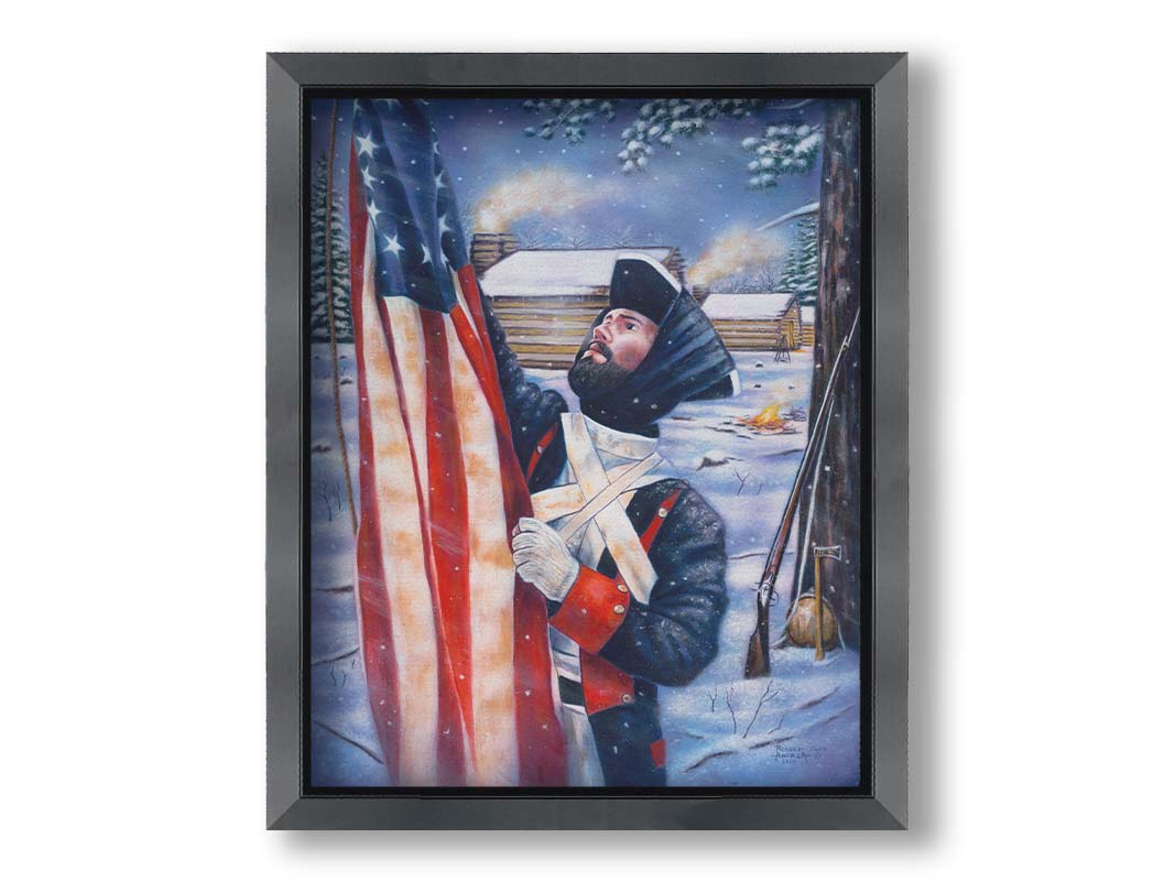 A painting of a Revolutionary War soldier raising an American flag. His musket, hatchet, and canteen rest against a tree behind him. The cabins of the fort are seen in the background. Printed on canvas and framed.