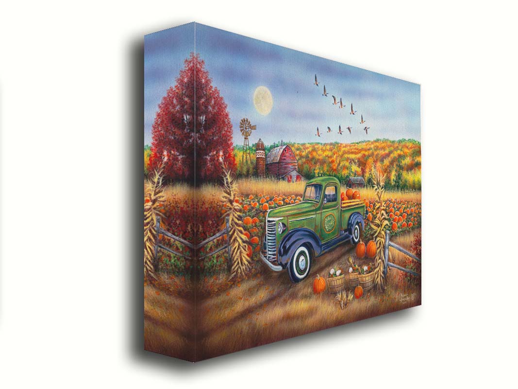 A painting of a farm, featuring a field of pumpkins and a field of corn. There is a forest of yellow, orange, red, and green fall trees in the background, and geese fly overhead. Printed on canvas.