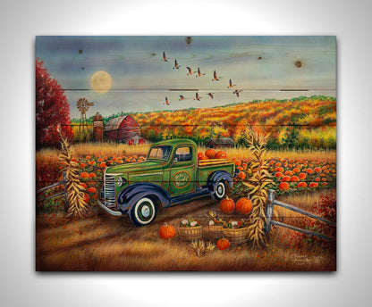 A painting of a farm, featuring a field of pumpkins and a field of corn. There is a forest of yellow, orange, red, and green fall trees in the background, and geese fly overhead. Printed on a wood pallet.