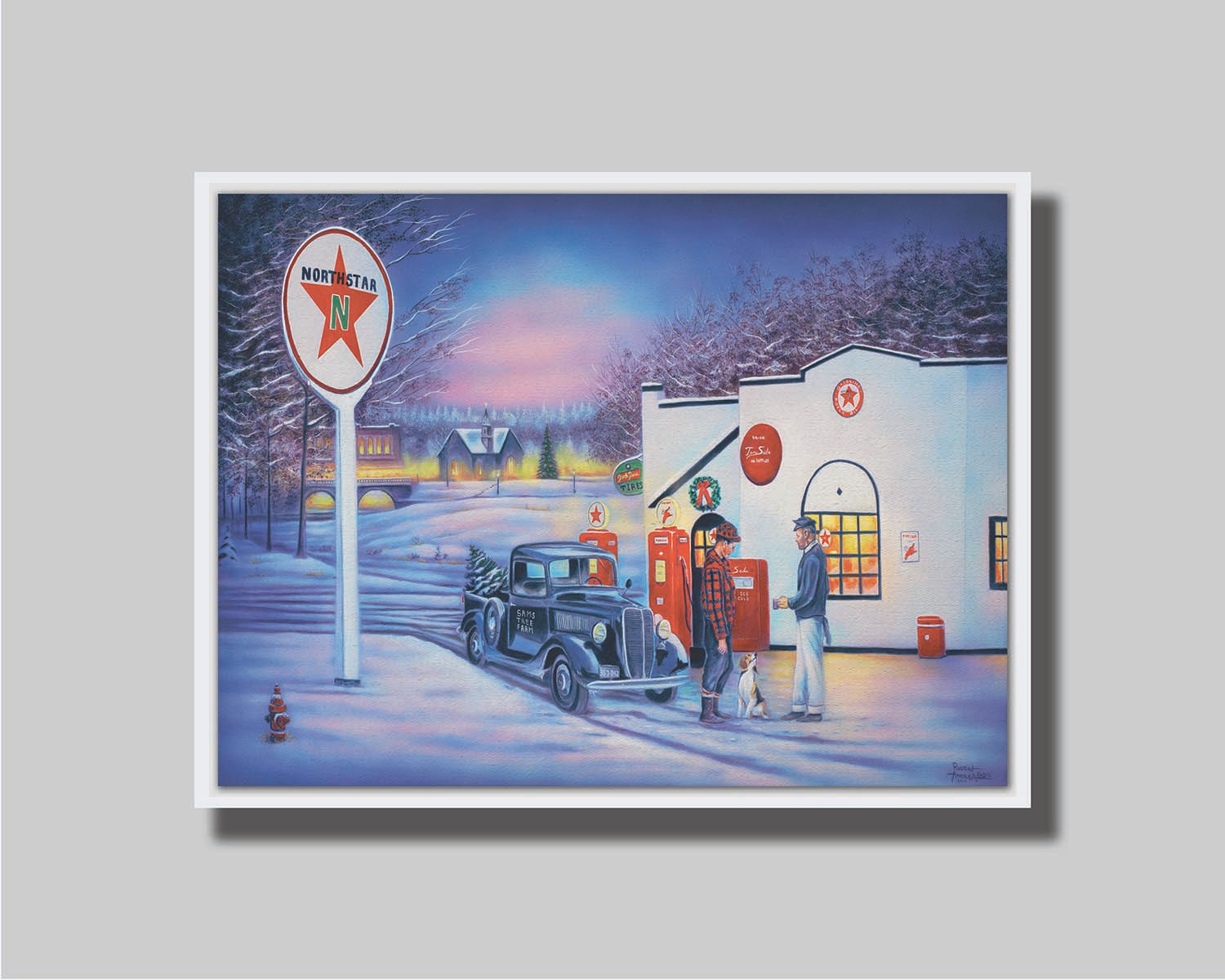 A painting of a small town scene in the snowy winter. Two people talk outside of a gas station beside a dog and an old car carrying a Christmas tree. Printed on canvas in a float frame.