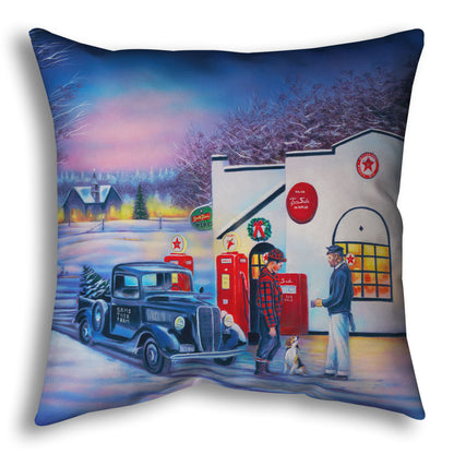 A throw pillow decorated with a 1950s Americana scene, with a vintage truck refueling at a Northstar gas station.