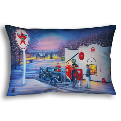 A throw pillow decorated with a 1950s Americana scene, with a vintage truck refueling at a Northstar gas station.
