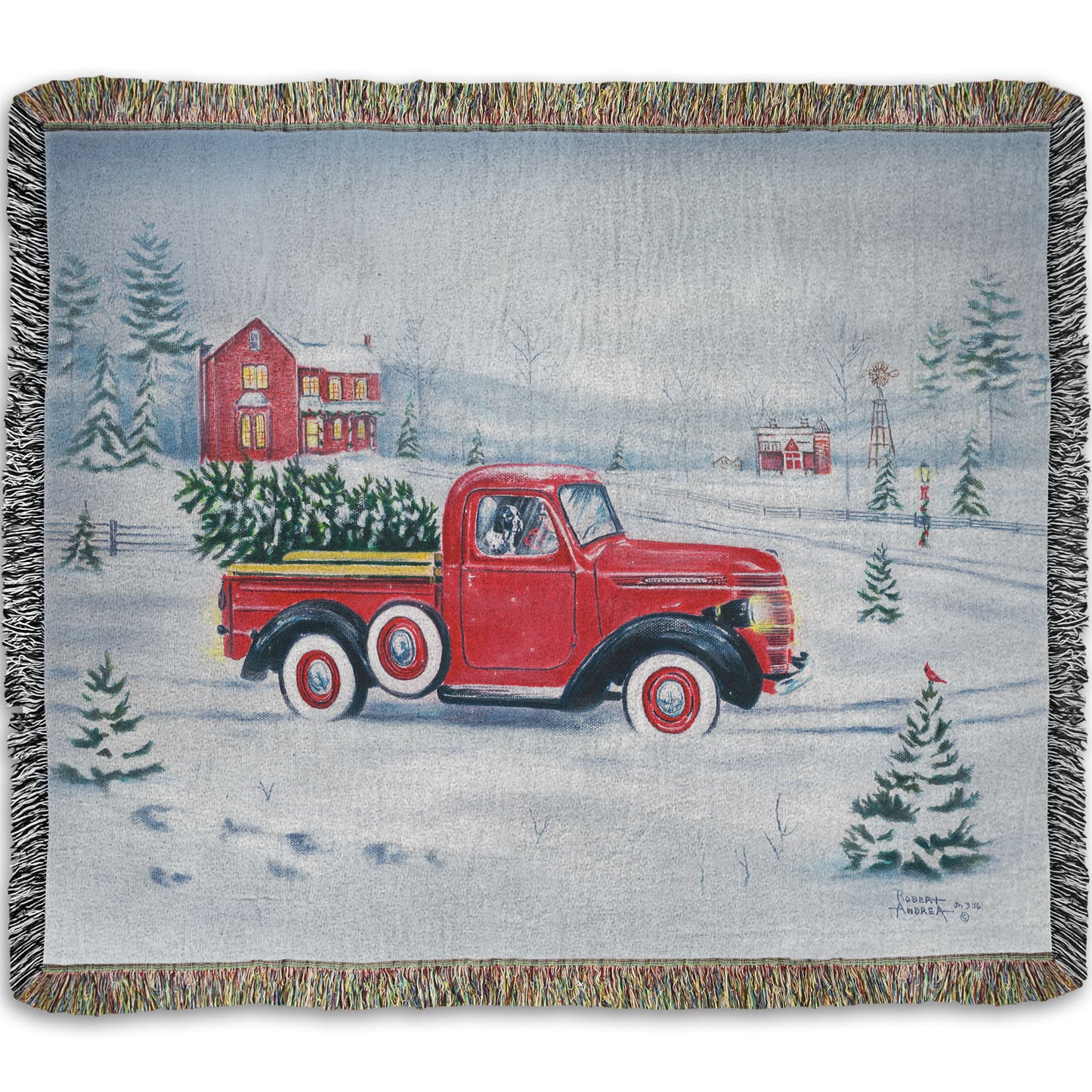 Woven blanket with a red truck and christmas tree design on a snowy background.