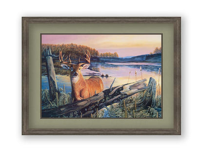 Painting of a deer in front of a lake reflecting the morning sky. Printed on paper, matted, and canvas.