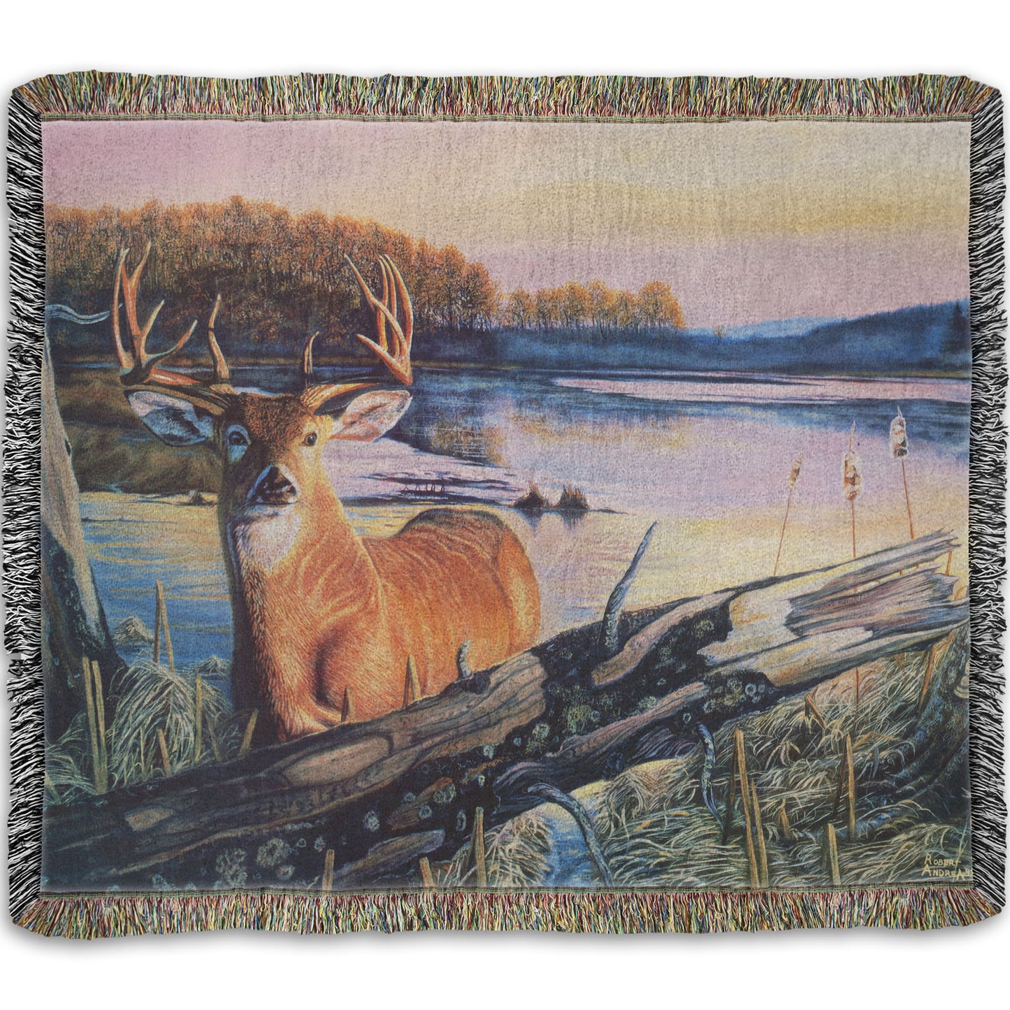 Woven throw blanket designed with a painting of a deer in front of a lake reflecting the morning sky.