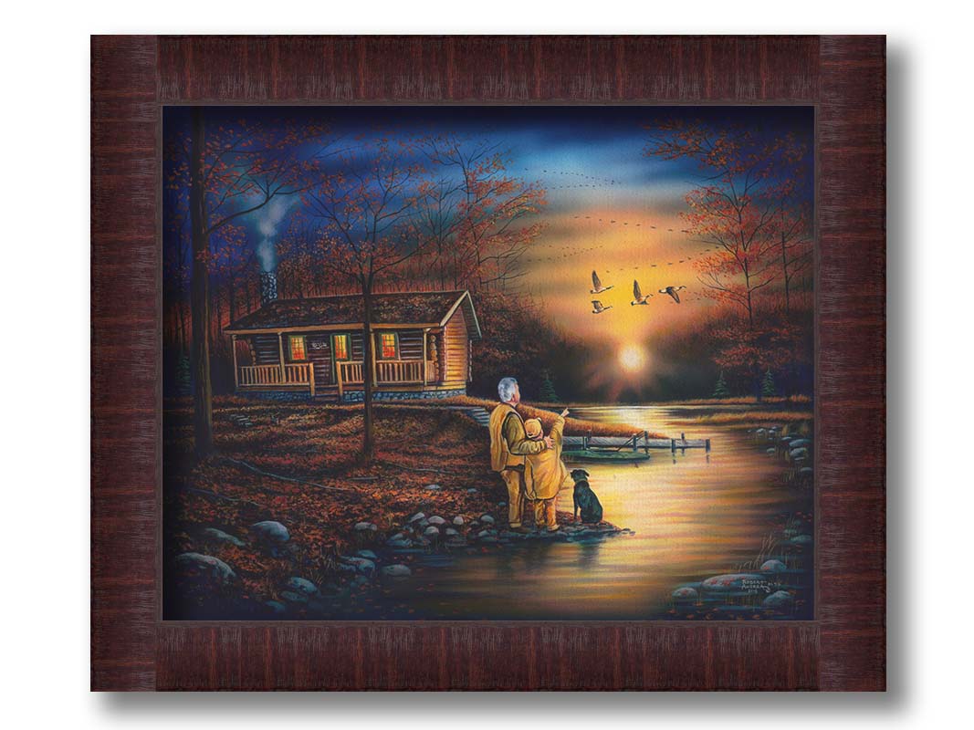 A painting of a man and a child standing by a river and cabin. They arre watching geese fly ovehead at sunset. Printed on canvas and framed.