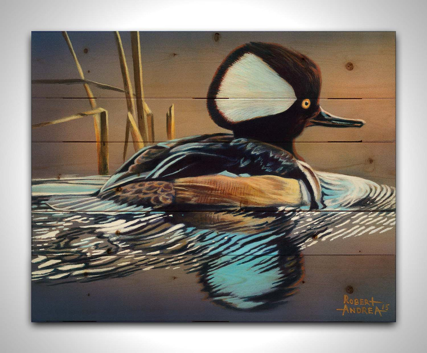 A painting of a hooded merganser duck, floating on the water with its reflection rippling below. Printed on a wood pallet.