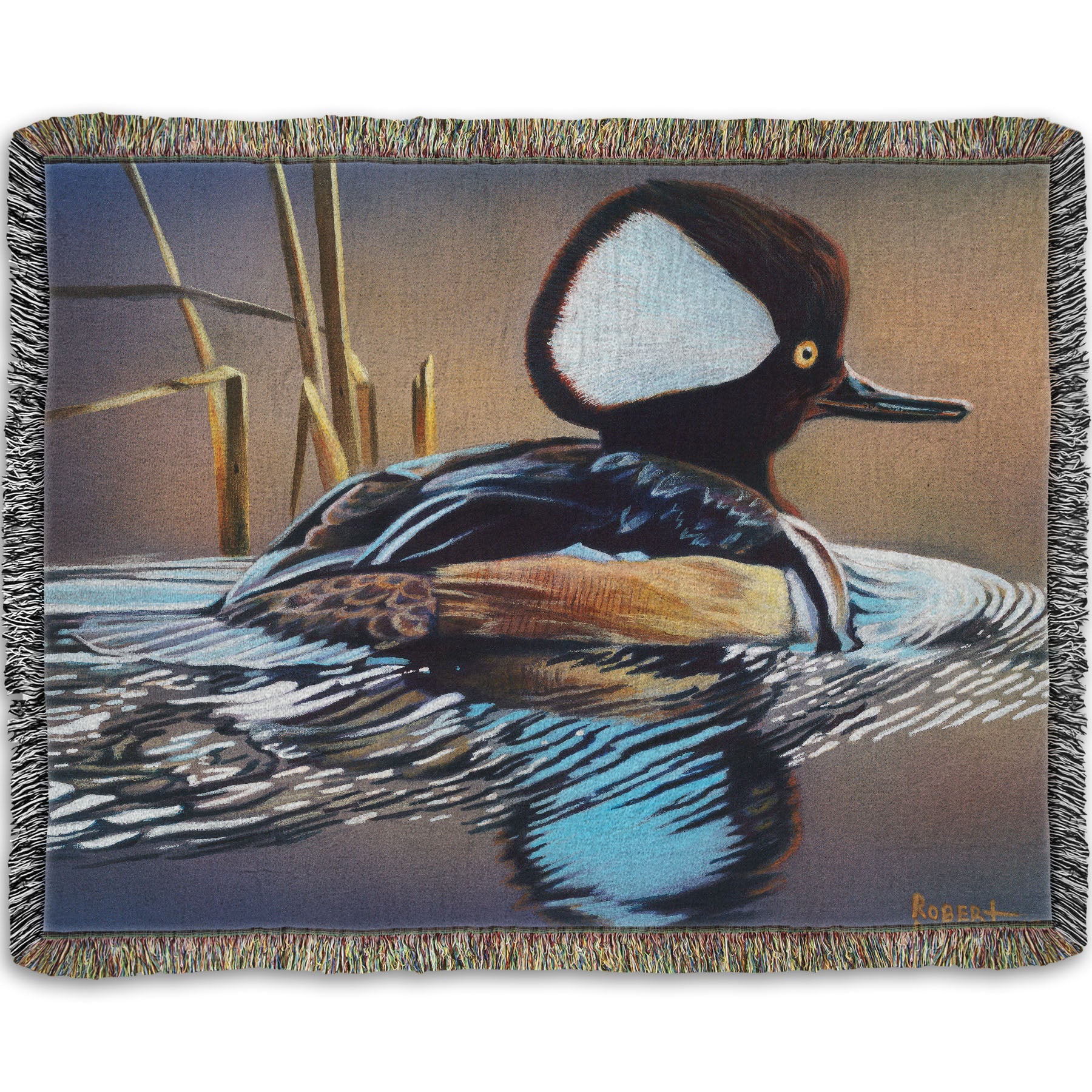 A woven throw blanket decorated with the design of a hooded merganser duck, floating on the water with its reflection rippling below.