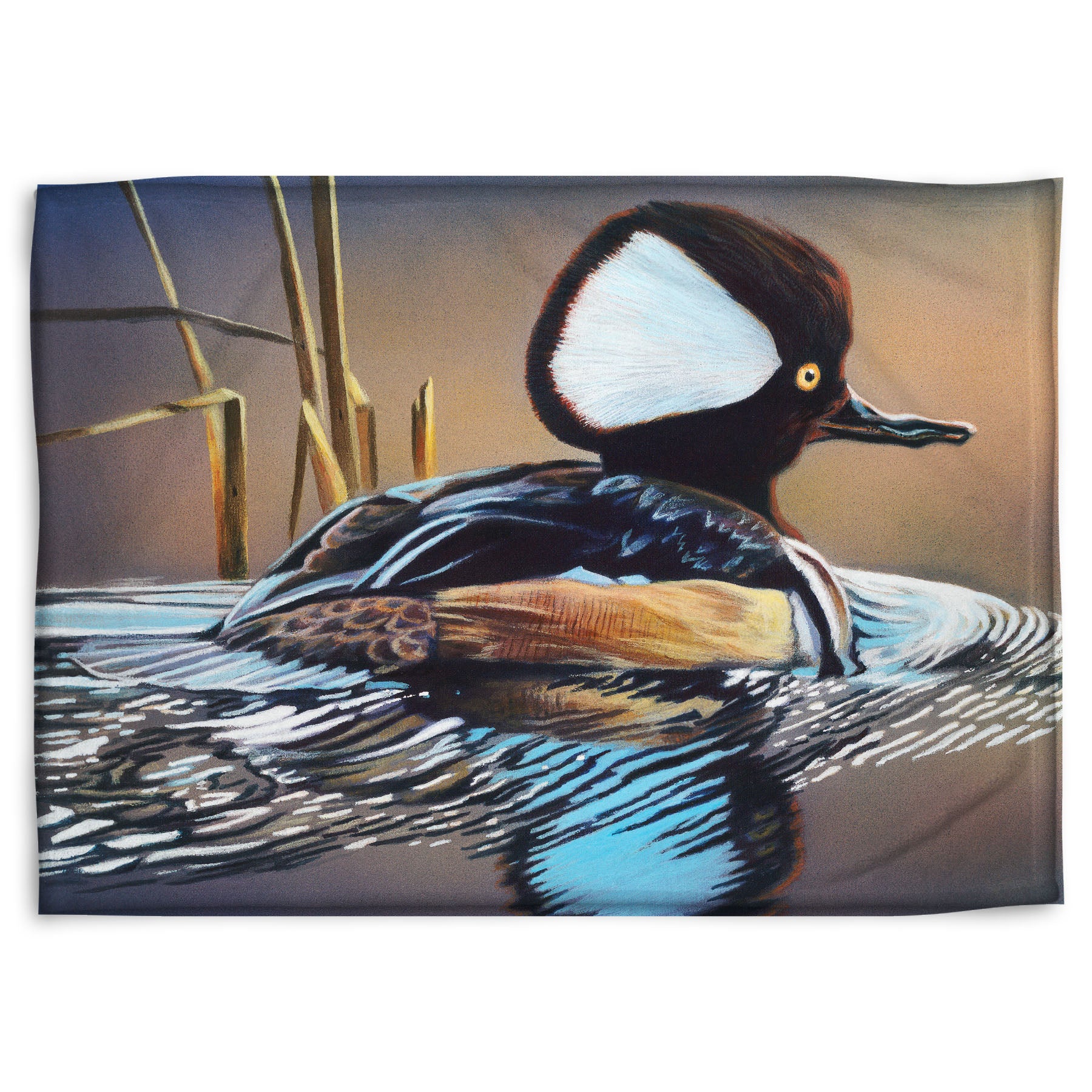 A coral fleece blanket decorated with the design of a hooded merganser duck, floating on the water with its reflection rippling below.