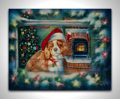 A painting of a little dog with a red santa hat, sitting inside near a fireplace. Printed on a wood pallet.